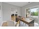 Bright office with modern desk, chair, and sliding glass doors leading to an outdoor patio at 14218 Morningate St, Huntersville, NC 28078