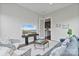 Cozy sitting room with modern furniture, TV, and doorway to kitchen at 14218 Morningate St, Huntersville, NC 28078
