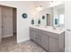 Bathroom featuring a double vanity with large mirrors and modern fixtures at 1479 Mocksville Hwy # 23, Statesville, NC 28625
