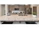 Close-up of a kitchen island with granite countertops, stainless steel appliances, and a sink at 1479 Mocksville Hwy # 23, Statesville, NC 28625
