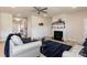 Comfortable living room featuring a cozy fireplace, ceiling fan, and modern decor with natural light and an open concept at 1479 Mocksville Hwy # 23, Statesville, NC 28625