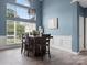 Light-filled dining room with wainscotting, modern lighting, and large windows at 1579 Matthews Dr, Rock Hill, SC 29732