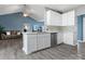 Modern kitchen featuring white cabinets, stainless steel appliances, marble countertop, and an eat-in peninsula at 1579 Matthews Dr, Rock Hill, SC 29732