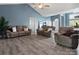 Spacious living room with vaulted ceilings, wood flooring, and comfortable seating at 1579 Matthews Dr, Rock Hill, SC 29732