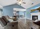Spacious living room with a fireplace, TV and ceiling fan at 1579 Matthews Dr, Rock Hill, SC 29732