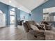 Open-concept living room with hardwood floors and view to dining and kitchen at 1579 Matthews Dr, Rock Hill, SC 29732
