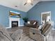 Cozy living room with a fireplace, TV, wood flooring, comfortable seating, and vaulted ceilings at 1579 Matthews Dr, Rock Hill, SC 29732