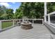 Relaxing back deck featuring a built-in stone fire pit with seating offering great views of the backyard at 17112 Green Dolphin Ln, Cornelius, NC 28031