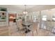 Elegant dining room with a modern chandelier, hardwood floors, neutral walls, and an open view to the lake at 17112 Green Dolphin Ln, Cornelius, NC 28031