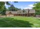 Well-maintained home with a large manicured lawn and mature trees at 17112 Green Dolphin Ln, Cornelius, NC 28031