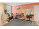 Home gym featuring an exercise bike, free weights, and mirrored wall at 17112 Green Dolphin Ln, Cornelius, NC 28031