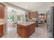 This open-concept kitchen features granite countertops, an island and seamless access to the breakfast nook at 17112 Green Dolphin Ln, Cornelius, NC 28031