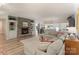Bright and airy living room with a stone fireplace and built in bookshelves at 17112 Green Dolphin Ln, Cornelius, NC 28031