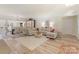 Spacious living room with hardwood floors, neutral paint, and elegant furnishings at 17112 Green Dolphin Ln, Cornelius, NC 28031