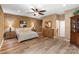 Bedroom with beautiful lighting, wood-style floors, and a ceiling fan at 17112 Green Dolphin Ln, Cornelius, NC 28031
