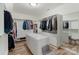 Custom walk-in closet with ample storage space including shelving and drawers at 17112 Green Dolphin Ln, Cornelius, NC 28031