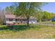 Aerial view of a charming single-story home with a fenced yard and two-car garage at 174 Stewart Acres Dr, Statesville, NC 28677