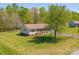 Aerial view of a well-maintained home with a fenced yard and mature trees at 174 Stewart Acres Dr, Statesville, NC 28677