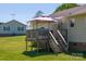 Outdoor wooden deck with steps leading to the backyard and gazebo at 174 Stewart Acres Dr, Statesville, NC 28677