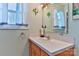 Bathroom with sink, vanity, mirror and window with natural light at 174 Stewart Acres Dr, Statesville, NC 28677