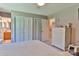 Bright bedroom with white wicker dresser, neutral walls, and a ceiling fan at 174 Stewart Acres Dr, Statesville, NC 28677