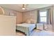 Bedroom featuring ceiling fan, bed, nightstand and window at 174 Stewart Acres Dr, Statesville, NC 28677