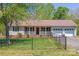 Charming home with a fenced yard, well-manicured lawn, and a two-car garage at 174 Stewart Acres Dr, Statesville, NC 28677