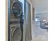 Convenient laundry area with stacked washer and dryer, maximizing space and efficiency at 174 Stewart Acres Dr, Statesville, NC 28677