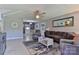 Inviting living room with contemporary furniture, ceiling fan, and neutral decor at 174 Stewart Acres Dr, Statesville, NC 28677