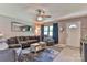 Comfortable living room with modern furnishings, a ceiling fan, and plenty of natural light at 174 Stewart Acres Dr, Statesville, NC 28677
