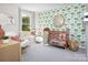 Adorable Bedroom with crib, rocking chair, elephant-themed wallpaper, and lots of natural light at 2425 Hedgecliff Rd, Kannapolis, NC 28025