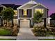 Charming townhome exterior at twilight with manicured landscaping and two-car garage at 2425 Hedgecliff Rd, Kannapolis, NC 28025