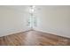 Well lit bedroom boasts laminate wood flooring and double windows at 260 Treebark Rd, Statesville, NC 28625