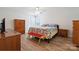 A bedroom is furnished with wood furniture and features a ceiling fan and natural light at 260 Treebark Rd, Statesville, NC 28625