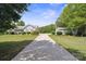 Charming single-story home with a lush lawn, complemented by a detached two-car garage and a long driveway at 260 Treebark Rd, Statesville, NC 28625
