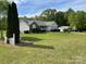 Charming home boasts a spacious yard, well-kept landscaping, and white picket fence, perfect curb appeal at 260 Treebark Rd, Statesville, NC 28625