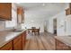 A view of the kitchen area leading to a dining area and featuring wooden cabinets at 260 Treebark Rd, Statesville, NC 28625