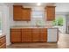 Bright kitchen features wooden cabinets and plenty of natural light, creating a welcoming atmosphere at 260 Treebark Rd, Statesville, NC 28625