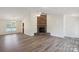Open-concept living room showcases a stone fireplace, vaulted ceilings, and natural light at 260 Treebark Rd, Statesville, NC 28625