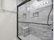 The updated shower features a frameless glass door, tile surround, and built-in niche at 260 Treebark Rd, Statesville, NC 28625
