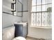 Small bathroom features a toilet, sink, and a stylish decorated window at 309 N Congress N St, York, SC 29745