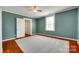 This bedroom has hardwood floors, fresh paint, and is bathed in natural light at 309 N Congress N St, York, SC 29745
