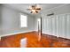 Bedroom with hardwood floors, closet, ceiling fan, and lots of natural light at 309 N Congress N St, York, SC 29745
