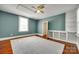 Bedroom boasts wood floors, fresh paint, natural light, and built-in shelves at 309 N Congress N St, York, SC 29745