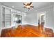 Bright living room boasts hardwood floors, built-in shelves, and view to the hallway at 309 N Congress N St, York, SC 29745