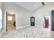 An open living area showcases brick floors and access to a bathroom and entry at 309 N Congress N St, York, SC 29745