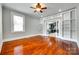 Bright living room boasts hardwood floors, built-in shelves, and view to the kitchen at 309 N Congress N St, York, SC 29745