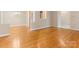 Bright, open living room featuring gleaming hardwood floors and neutral paint at 3615 Champaign St, Charlotte, NC 28210
