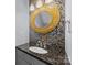 Stylish bathroom features mosaic tiles, a unique round mirror, and a granite countertop sink at 3736 Melrose Cottage Dr, Matthews, NC 28105
