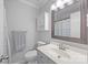 Well-maintained bathroom with updated fixtures, vanity, mirror, and ample lighting at 3736 Melrose Cottage Dr, Matthews, NC 28105